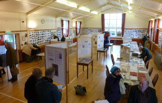 The Wm Loveless Hall with hundreds of John Stewart's photographs and Wivenhoe Memorabilia plus the display stands showing WW1 panels created by Lesley McCabe   | Photo: Peter Hill