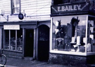 Mrs E. Bailey's Outfitters next door to George Went's Cycle and Radio Agent Shop (now the Wivenhoe Bookshop) | Wivenhoe Memories Collection